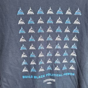 Build Black Political Power size small unisex t-shirt. Dark marks are shadows.